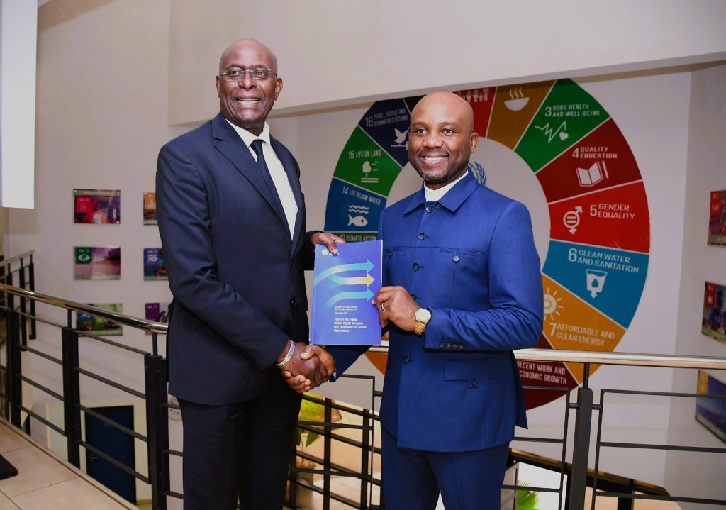 Hon. Minister of Innovation, Science and Technology, FMIST, Dr. Kingsley Tochukwu Udeh, SAN, (right) receiving compendium booklet of UN activities from the United Nations Resident and Humanitarian Coordinator Mr. Mohamed Malick (left) during the Courtesy visit by the Hon. Minister to the UN House , today in Abuja.