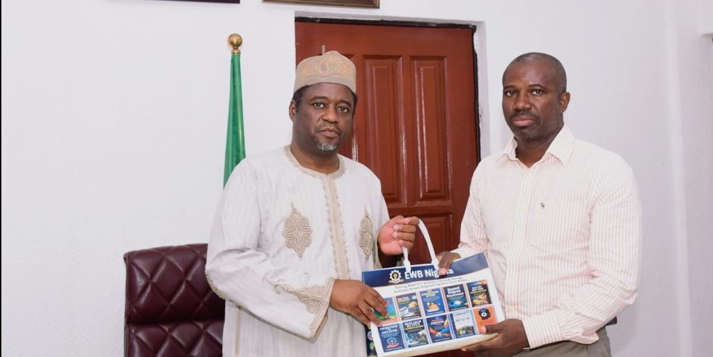 Permanent Secretary, Federal Ministry of Innovation, Science and Technology FMIST, Dr. Mukhtar Yawale Muhammad, mni () receiving a compendium outcome Driven Engineering Education books from the Executive Director, Engineers Without Boarders (EWB) Nigeria Mr. Oladimeji Olutimehin (right) during the visit.